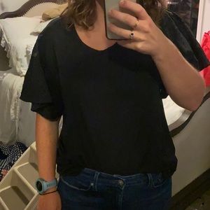 black shirt with textured sleeves